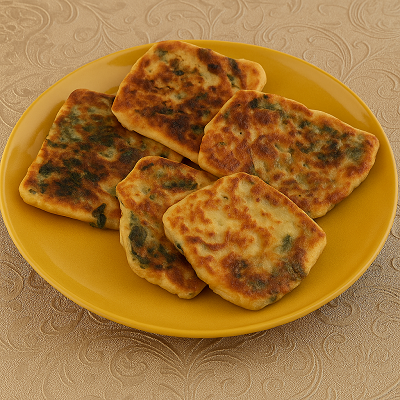 Stuffed Msemen with Suet placed beside a cup of mint tea
