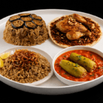 heritage-rich eastern meals served on a white plate with traditional Middle Eastern dishes on black background