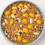 A bowl of mixed legumes including lentils, beans, and lupini beans, representing the healthiest plant-based foods for balanced nutrition.