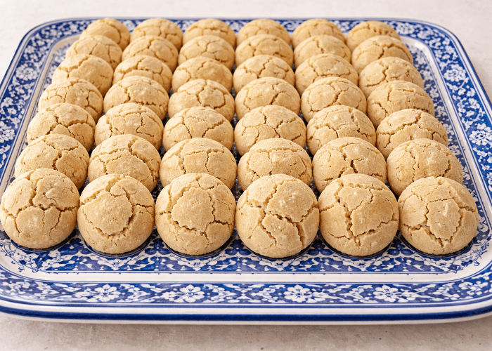 Traditional Moroccan ghriba cookies served on blue and white decorative plate